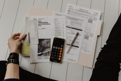 Financial planning with calculator and notebook on desk