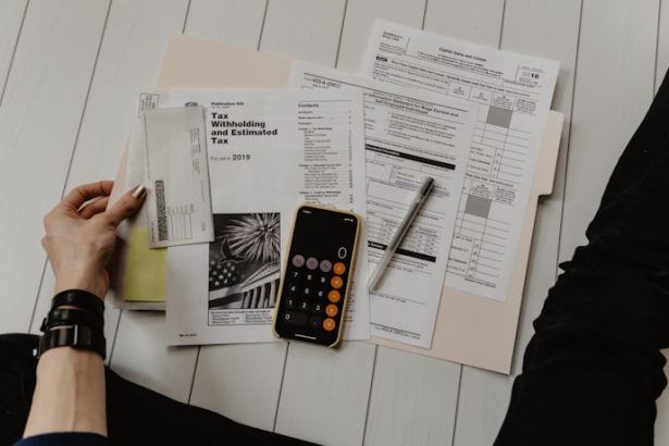 Financial planning with calculator and notebook on desk